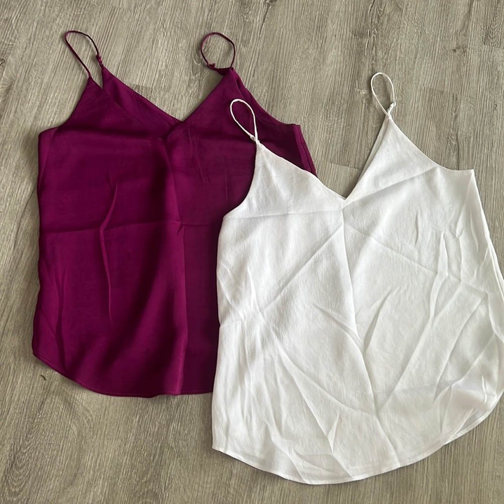 Express tanks in used condition. Purple is size XS and white is size S.